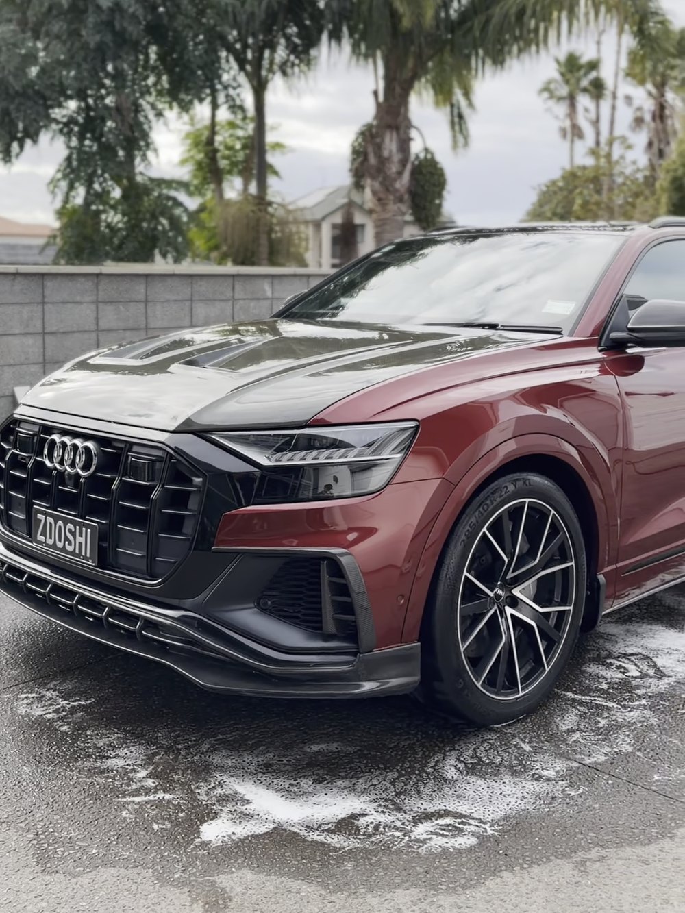 Audi Q8 in red after a wash and detail